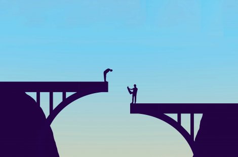 two men standing on a misaligned bridge