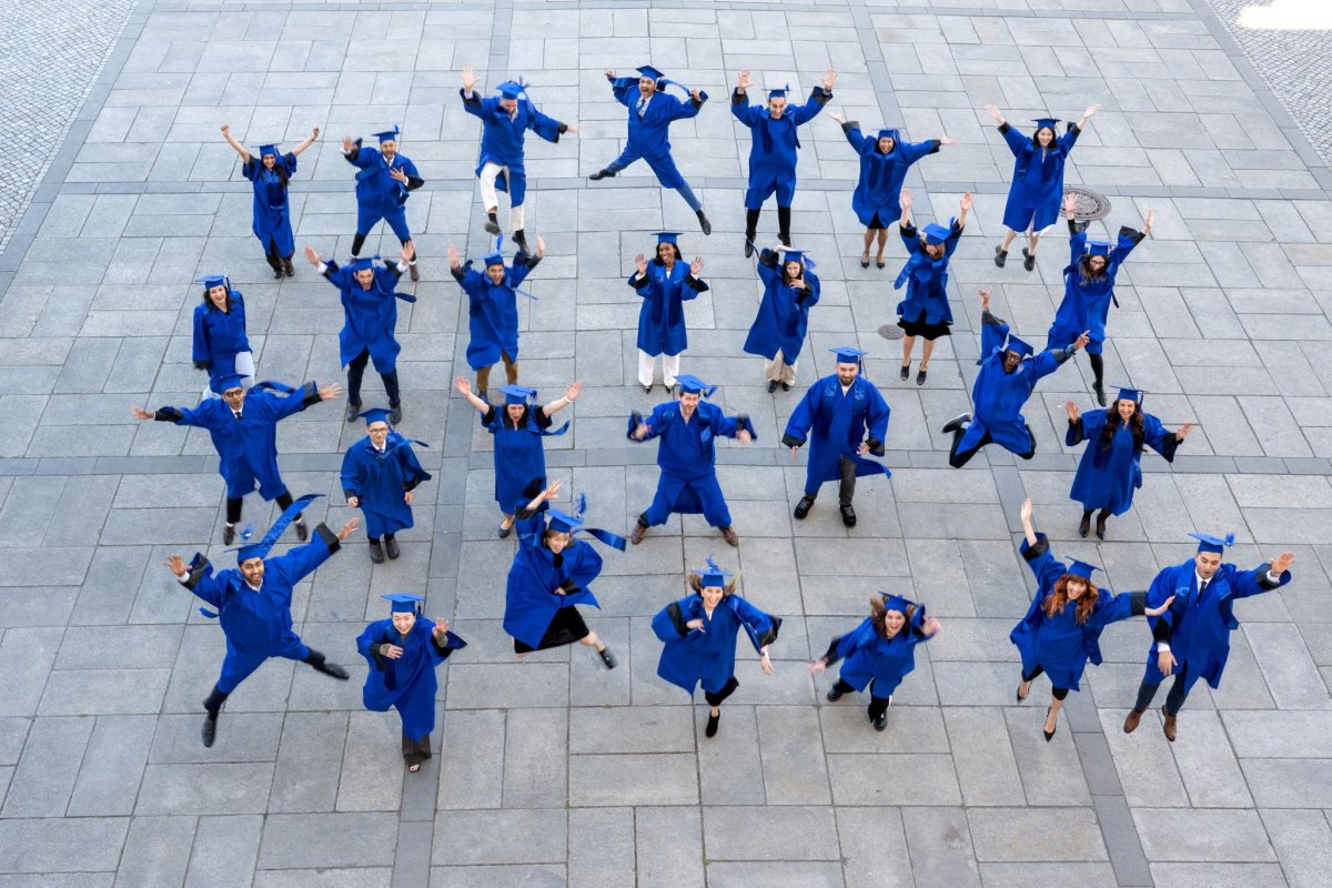 The ESMT Full-time MBA Class of 2026 jumping for joy after graduation