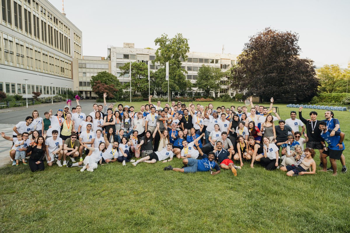 ESMT Berlin staff and students posing for a big group shot at the ESMT Olympics