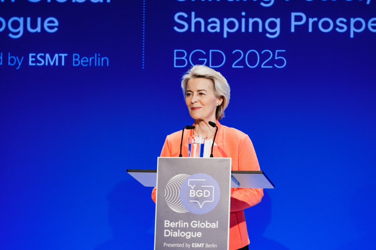 Ursula von der Leyen speaking at Berlin Global Dialogue podium against blue conference backdrop