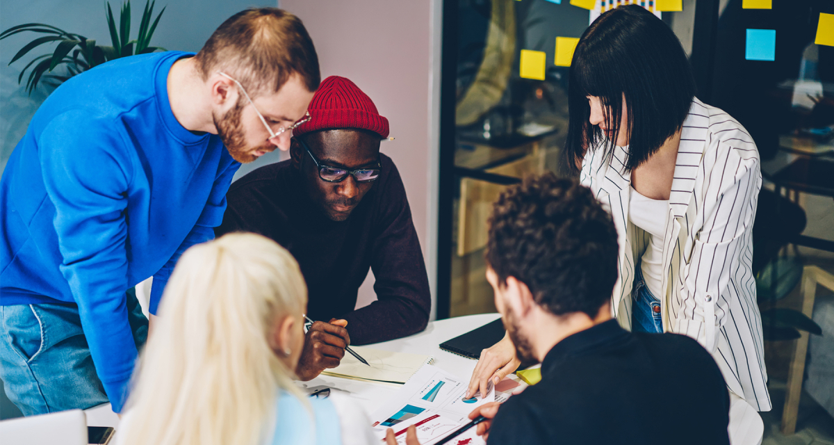 Group of young diverse people working together