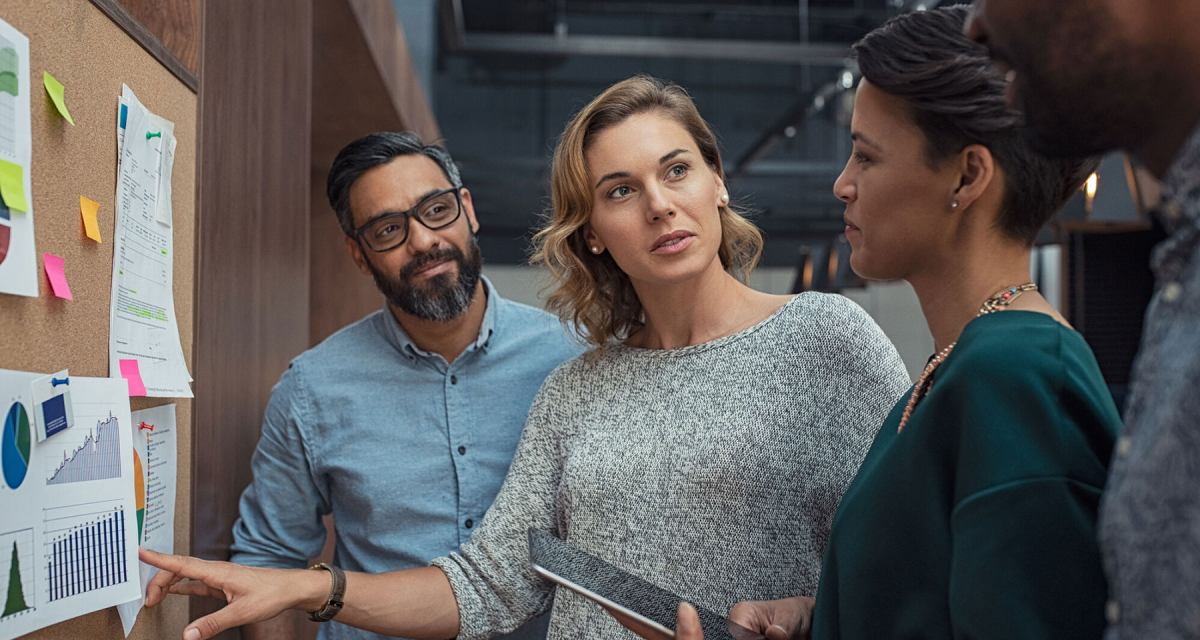 Multiethnic business people discussing charts and graphs
