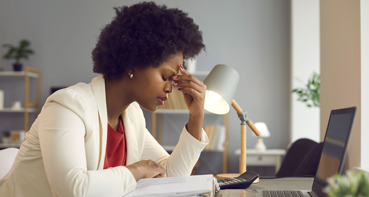Frustrated african american woman keeping eyes closed and massaging nose