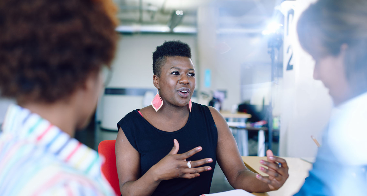 Black woman talking at meeting