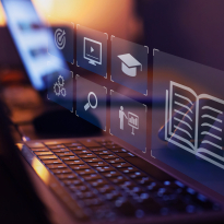 concept of edtech using laptop and a hovering reflection of education icons