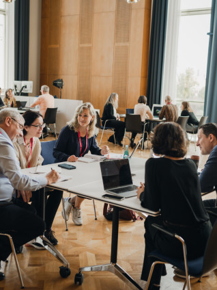 groups of people in multiple tables