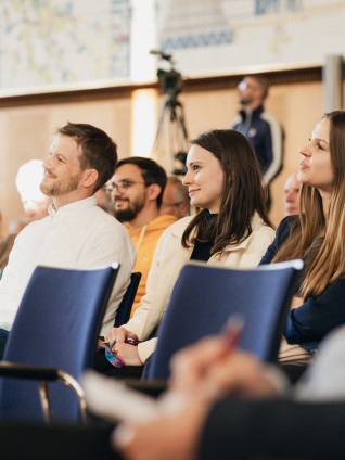 Audience members smiling