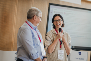 Man and woman at a conference at ESMT Berlin