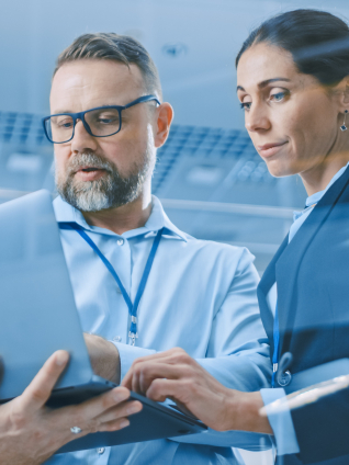 Businesswoman and Businessman Working on a AI Project