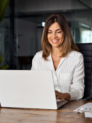 business woman CEO using laptop application for work at table workspace in office