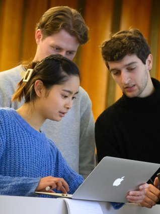 ESMT Berlin master's students intently looking at an online course together