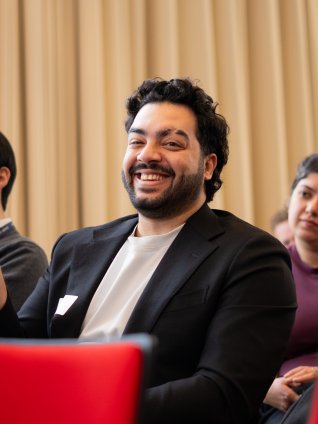 ESMT Berlin Part-time MBA student Max Rafaat asking a question during a panel discussion at the campus Career Fair