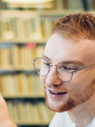 Image of students working together in an office