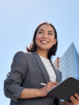 business woman leader standing on the street in big city