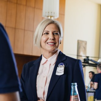 ESMT Berlin Global Online MBA alum Justina Geneviciute speaking with classmates