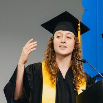 ESMT Master in Global Management student Elise Most making a speech on stage at graduation