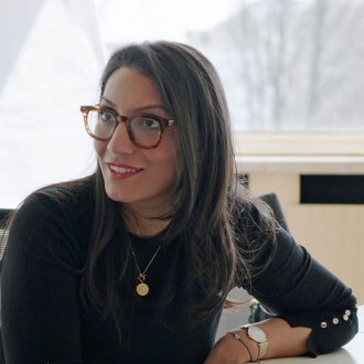 ESMT Part-time MBA student Rojda Emre in discussion with a classmate