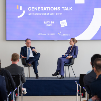 Master's student Sophie von Rohr and Alexander Mayer, Head of Germany & Austria at J.P. Morgan, on stage in front of audience during the Generations Talk event at ESMT Berlin