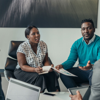Team of african business people debating during a work meeting.