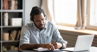 man working from home online
