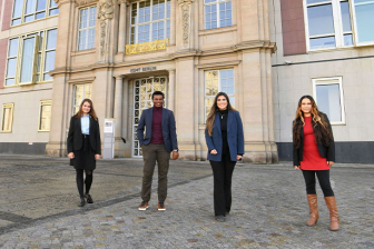 4 MIM students standing in fron of the ESMT building 