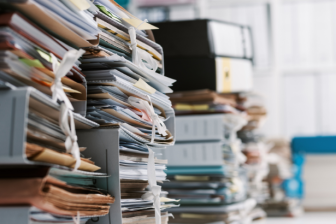 A big amount of files on a desk.