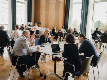 groups of people in multiple tables