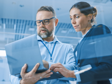 Businesswoman and Businessman Working on a AI Project