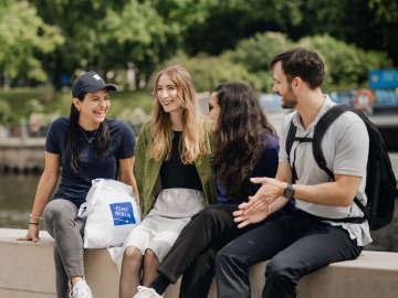 Students from ESMT Berlin enjoying a summer day by the Spree
