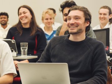 ESMT Berlin Master in Analytics and Artificial Intelligence student Jean-Christophe Scheider sitting in a class with his cohort