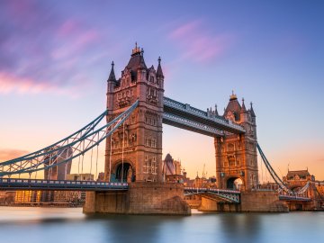 Tower Bridge in London with a view of the Gherkin in the background