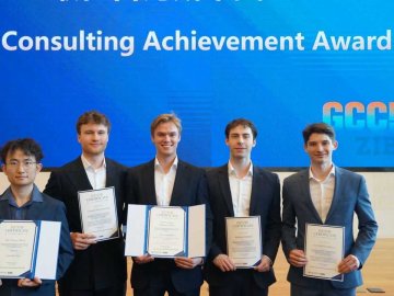 ESMT master's students with their certificates after winning a consultancy competition at ZIBS