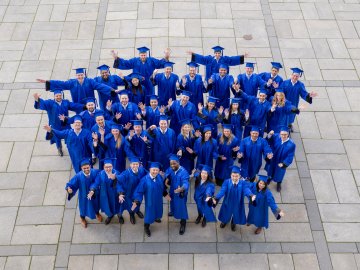 ESMT Berlin Part-time MBA graduating class, in their gowns on campus