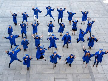 The ESMT Full-time MBA Class of 2026 jumping for joy after graduation