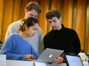 ESMT Berlin master's students intently looking at an online course together