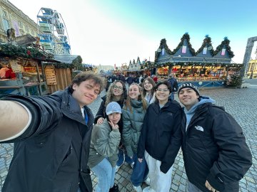 ESMT Master in Analytics and AI student Victoria Landazuri and friends from her degree program at a Christmas market
