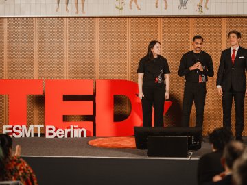 ESMT Berlin student organizers on stage at the TEDxESMT Berlin event