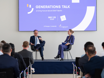 Master's student Sophie von Rohr and Alexander Mayer, Head of Germany & Austria at J.P. Morgan, on stage in front of audience during the Generations Talk event at ESMT Berlin
