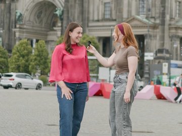 Two students from ESMT Berlin's Master in Innovation and Entrepreneurship interviewing each other in front of the Berliner Dom