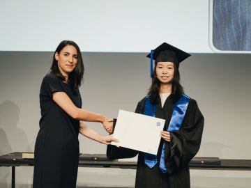 Portrait of ESMT Master in Innovation and Entrepreneurship student Yuxin Huang during her graduation ceremony
