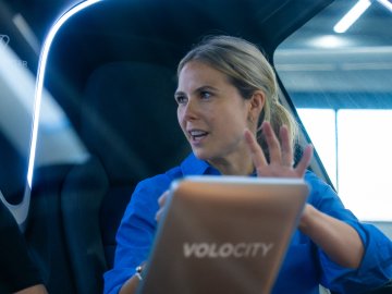 Image of ESMT Berlin Full-time MBA alum Marie Masson, on the job in an aircraft in her role of Head of Sales and Marketing at Volocopter