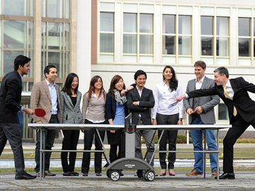 Students playing table tennis on ESMT campus