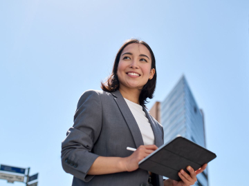 business woman leader standing on the street in big city