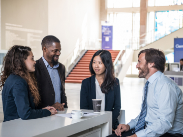 MBA students talking in the foyer