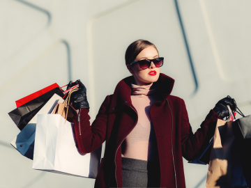 well-dressed person in sunglasses after a shopping spree
