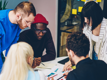 Group of young diverse people working together