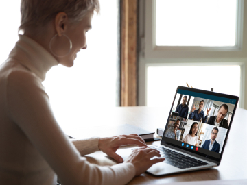 woman working remotely from home on video call