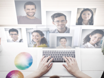 Person communicating via laptop with virtual team