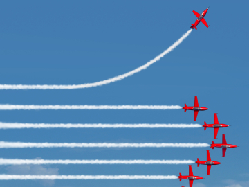 Planes flying in a row with one plane going in it a different direction