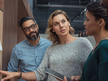Multiethnic business people discussing charts and graphs
